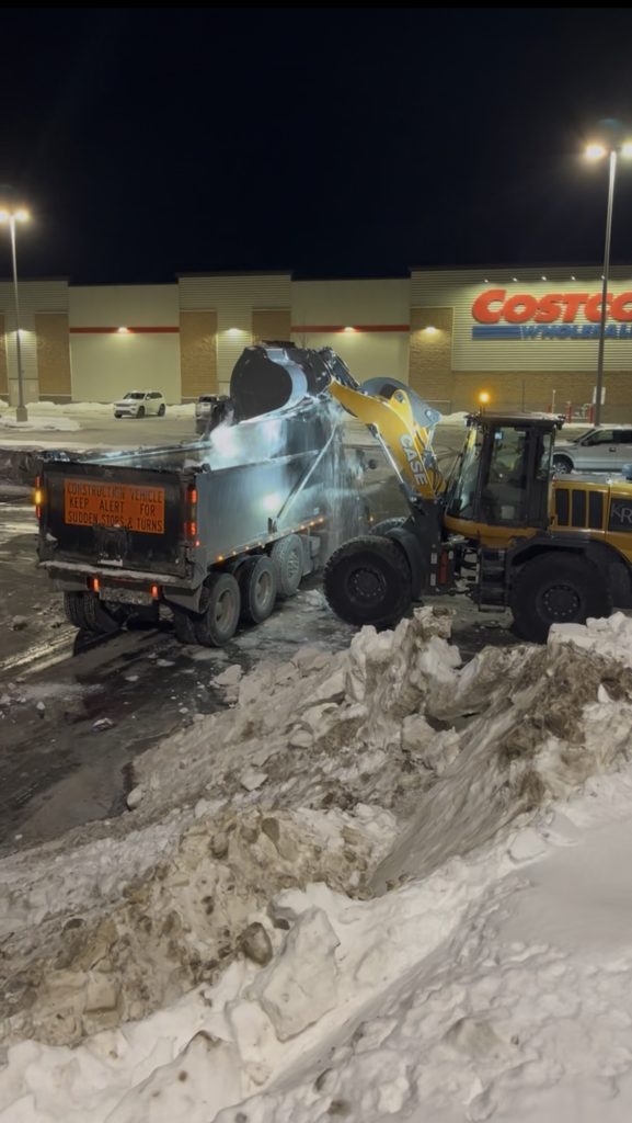 Costco parking lot getting de-iced and snow plowed